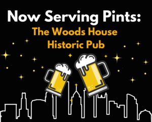 Black image with white outline of the Pittsburgh Skyline along the bottom. The heading says, "Now serving pints: The Woods House Historic Pub" and below the words are two pints of beer about to cheers each other. Yellow stars fill the background.